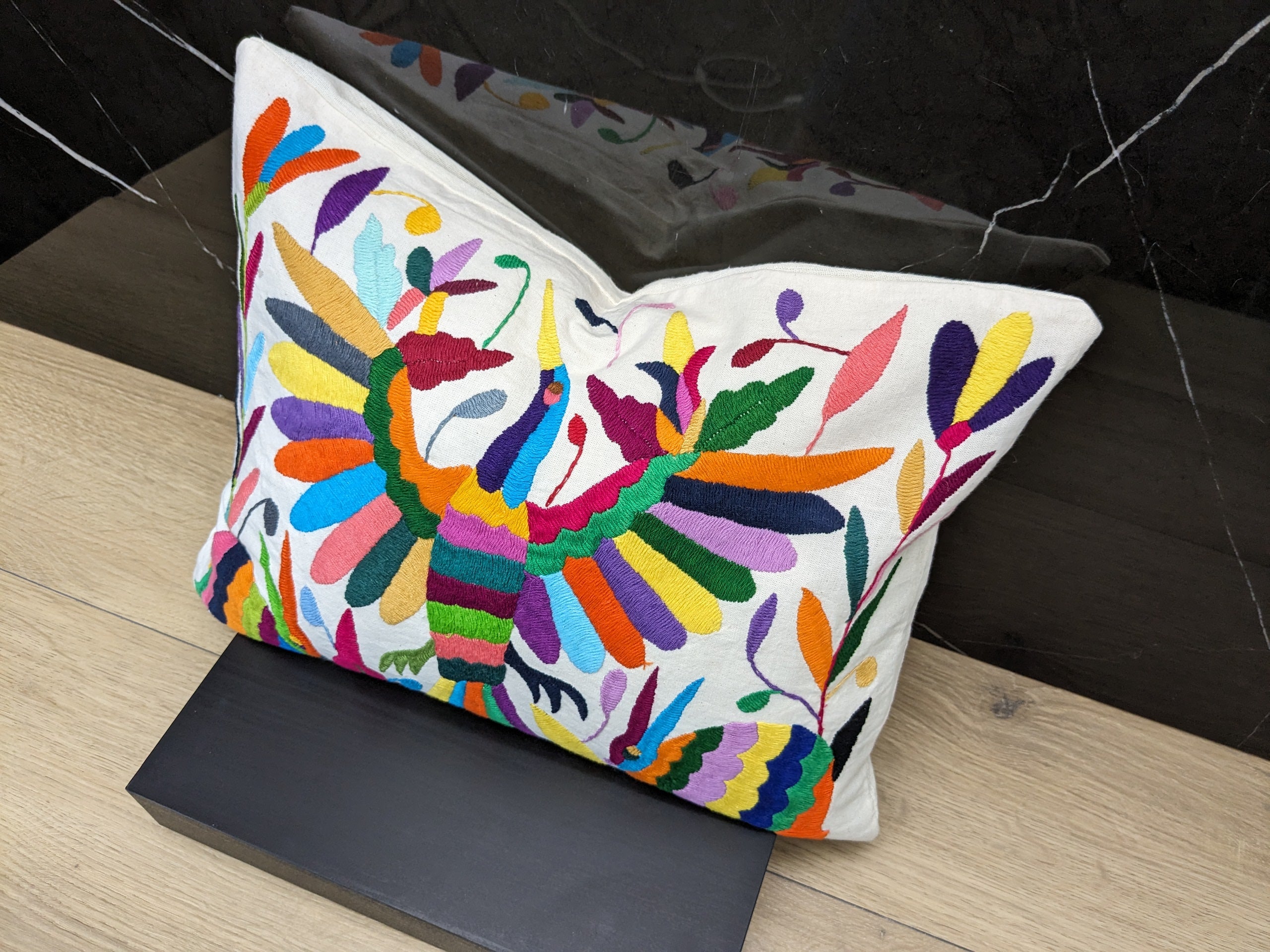 Rectangle Otomi Tenango Pillow Cover with Hand Embroidered Birds, Flowers, and Animals in Vibrant Colors. Handmade in Mexico. We package and ship from the USA. Buy now at www.felipeandgrace.com.