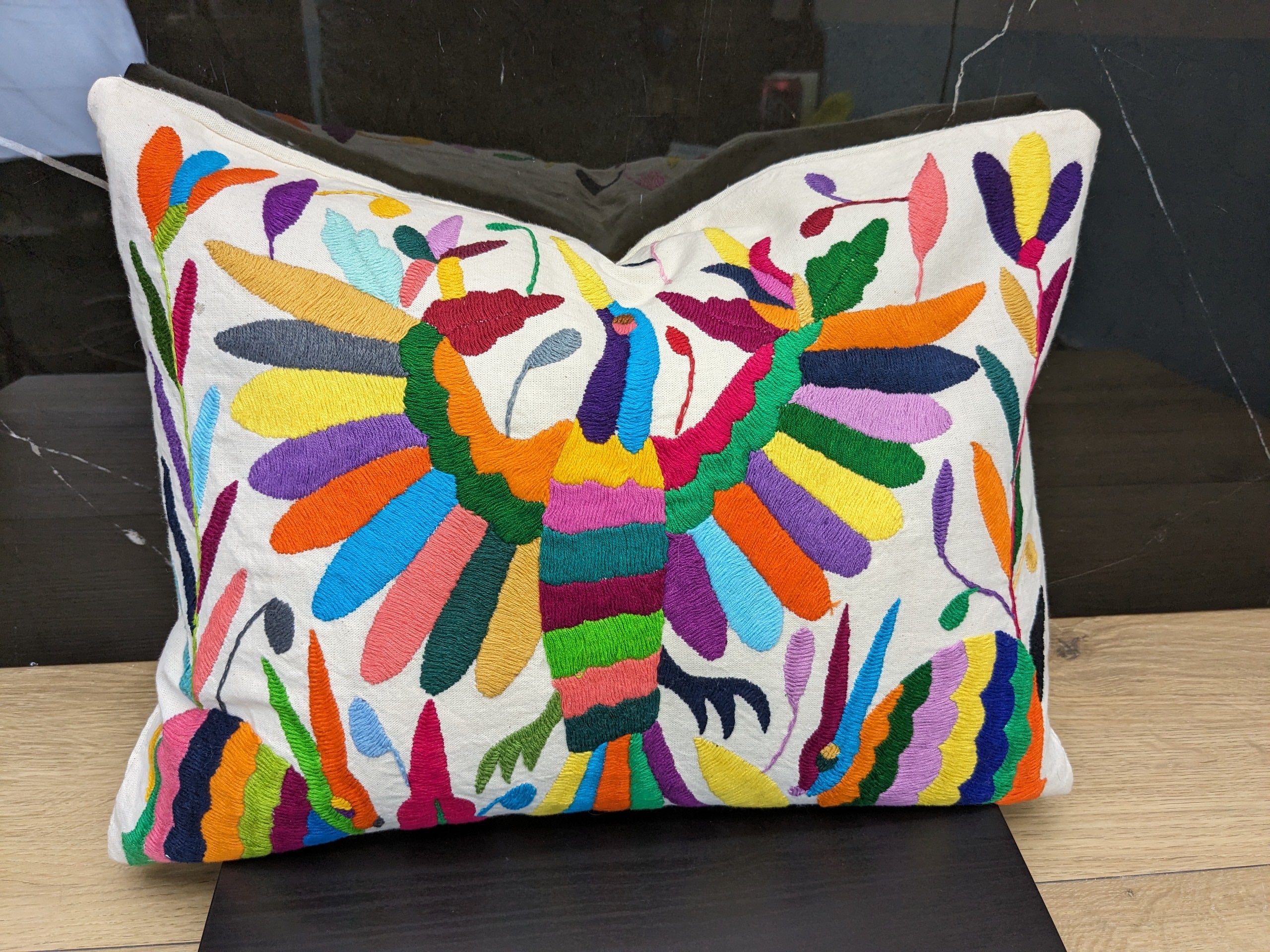 Rectangle Otomi Tenango Pillow Cover with Hand Embroidered Birds, Flowers, and Animals in Vibrant Colors. Handmade in Mexico. We package and ship from the USA. Buy now at www.felipeandgrace.com.