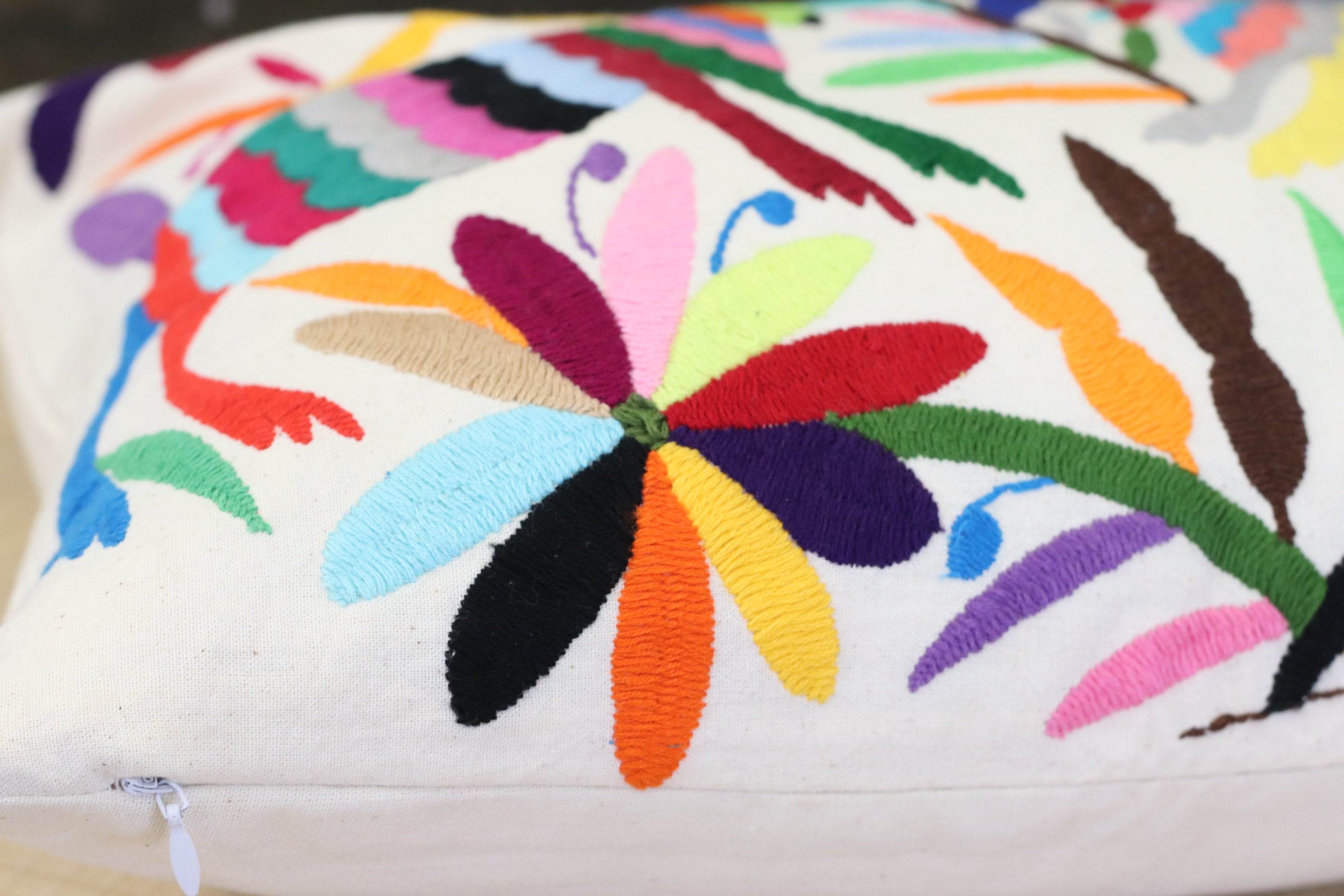 Rectangle Otomi Tenango Pillow Cover with Hand Embroidered Birds, Flowers, and Animals in Vibrant Colors. Handmade in Mexico. Ships from the USA. Buy now at www.felipeandgrace.com.