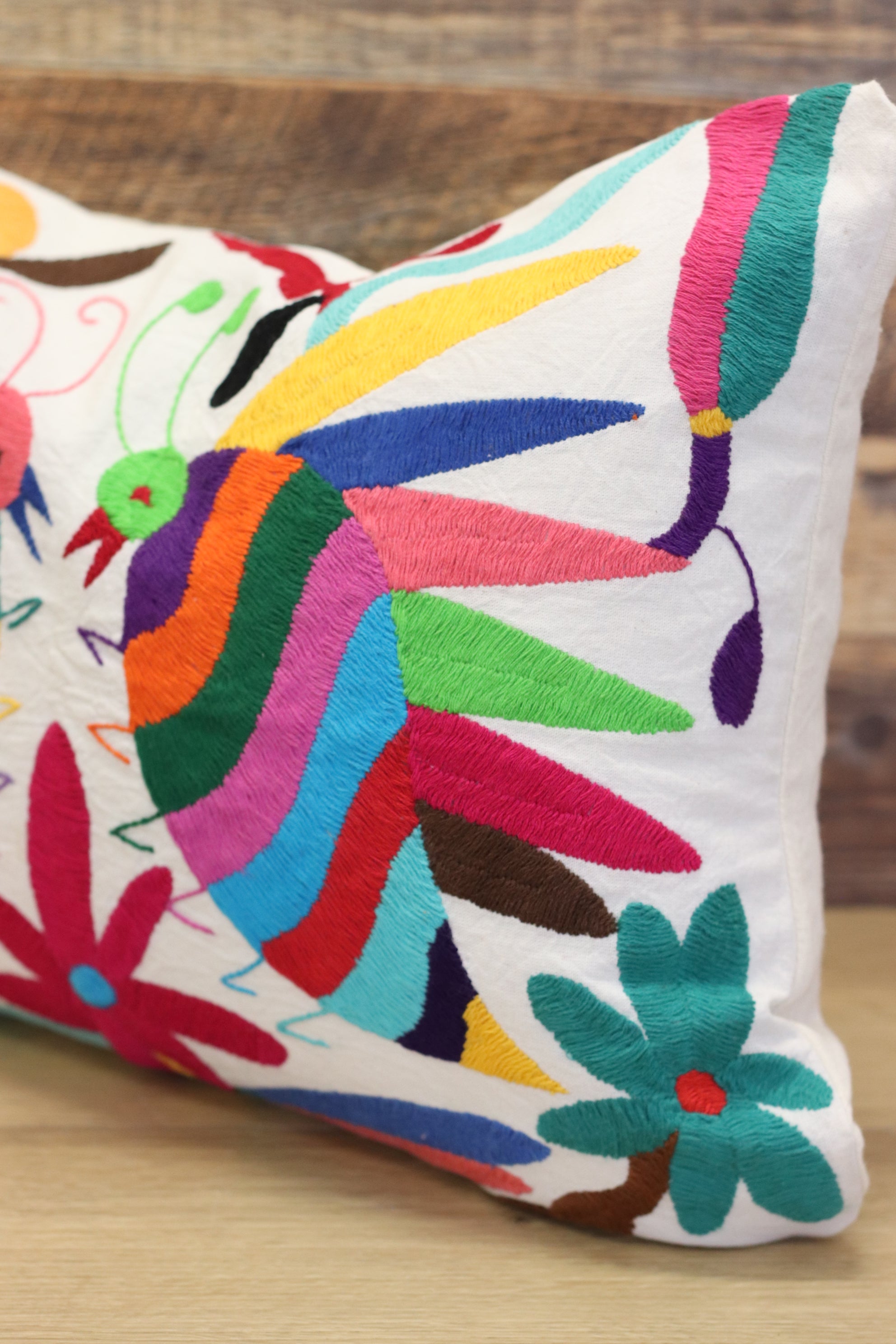 Otomi Tenango Pillow Cover Hand Embroidered with Cute Bugs and Flowers in Vibrant Colors. Handmade in Mexico. Ships from the USA. Buy now at www.felipeandgrace.com. 