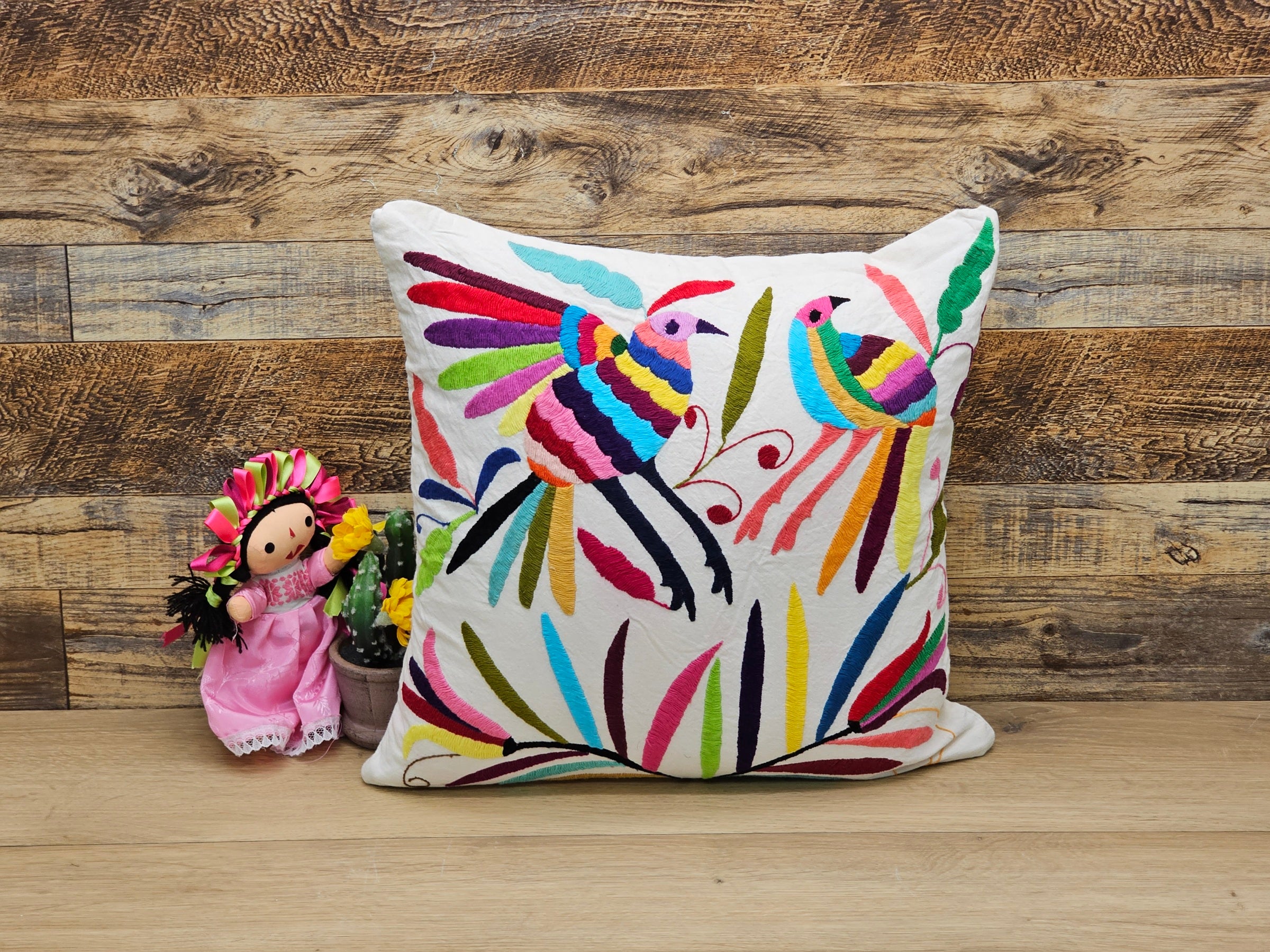 Square Otomi Tenango Pillow Cover with Hand Embroidered Birds and Plants in Vibrant Colors. Handmade in Mexico. Ships from the USA. Buy now at www.felipeandgrace.com.