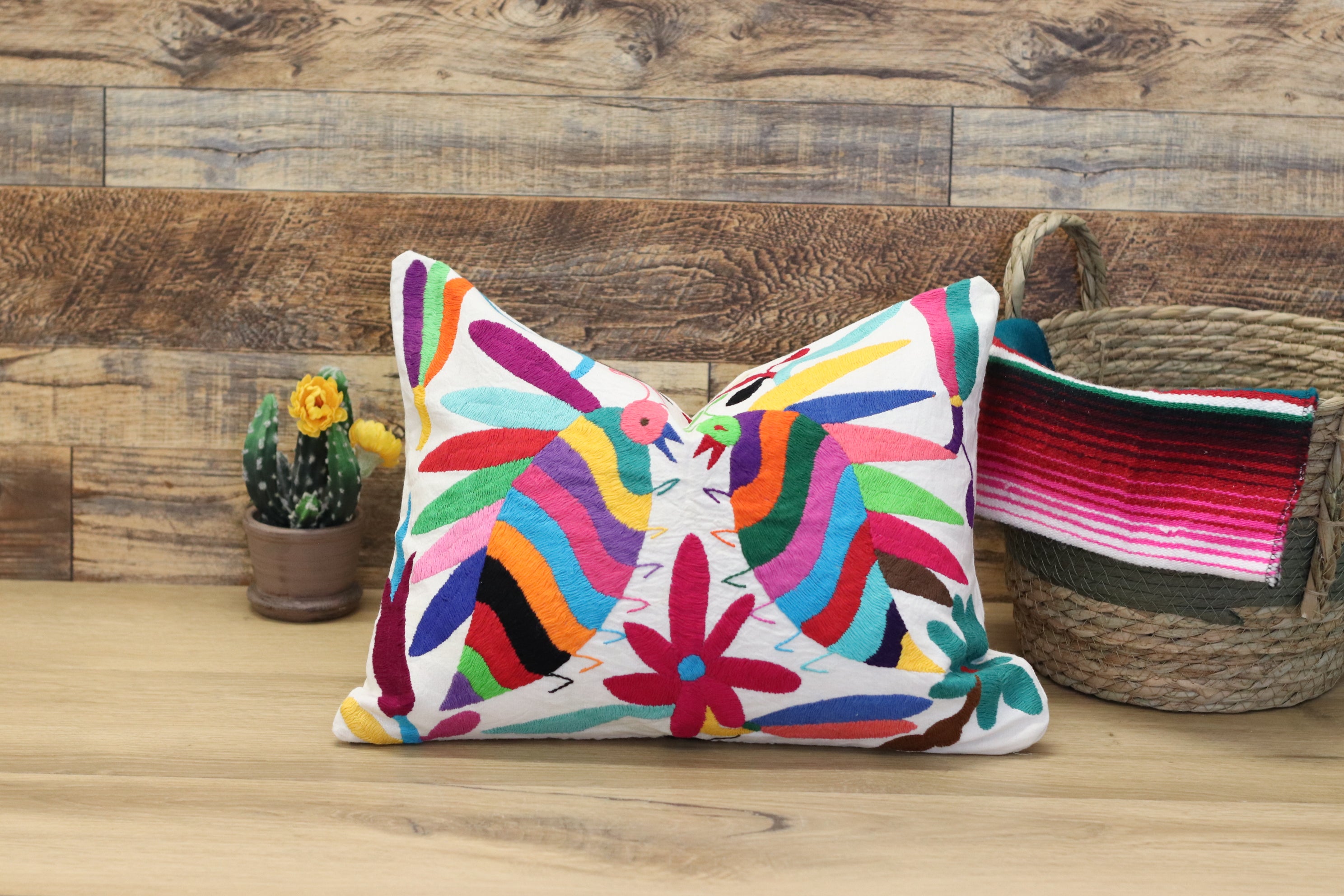 Otomi Tenango Pillow Cover Hand Embroidered with Cute Bugs and Flowers in Vibrant Colors. Handmade in Mexico. Ships from the USA. Buy now at www.felipeandgrace.com. 