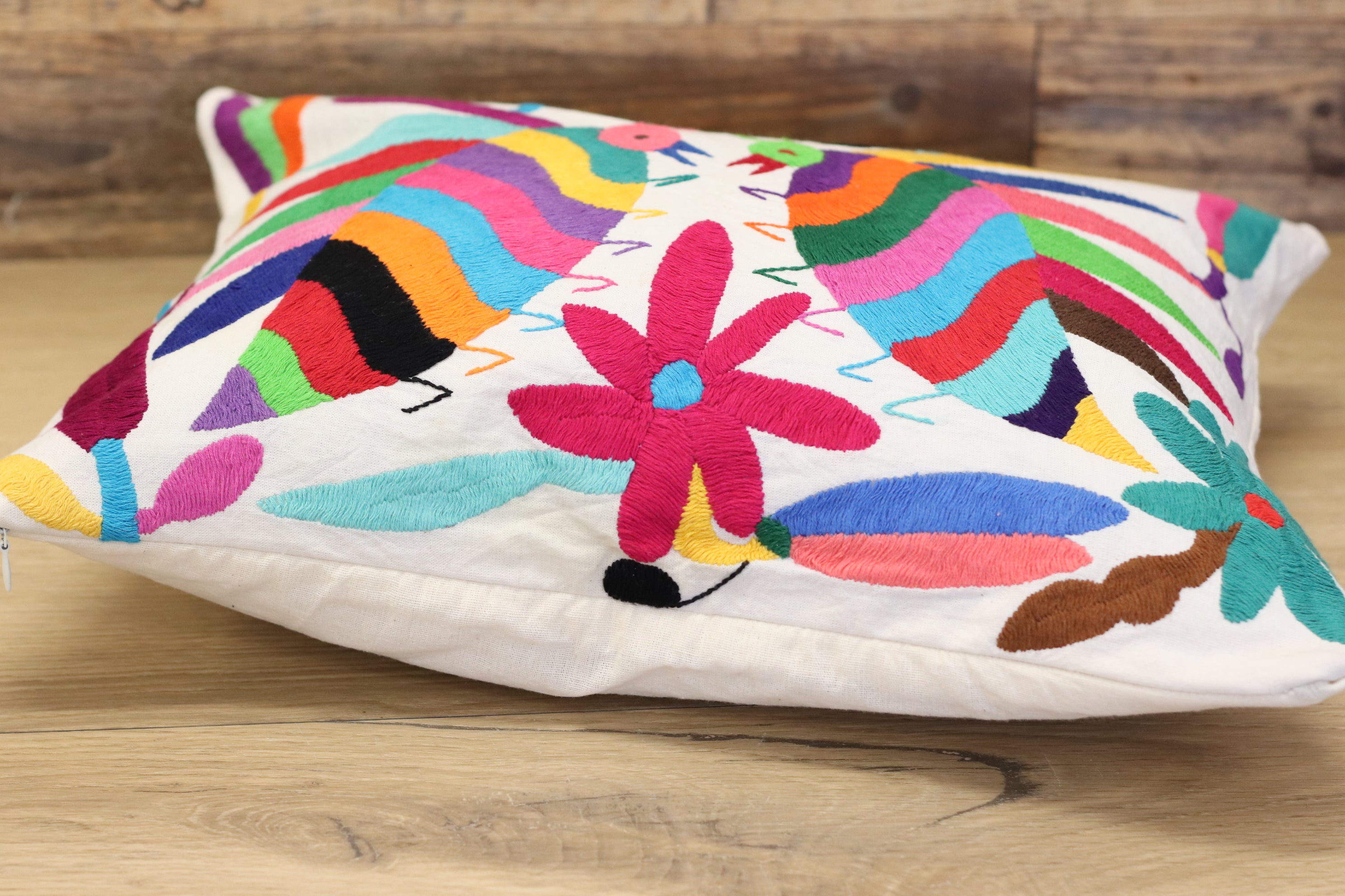 Otomi Tenango Pillow Cover Hand Embroidered with Cute Bugs and Flowers in Vibrant Colors. Handmade in Mexico. Ships from the USA. Buy now at www.felipeandgrace.com. 