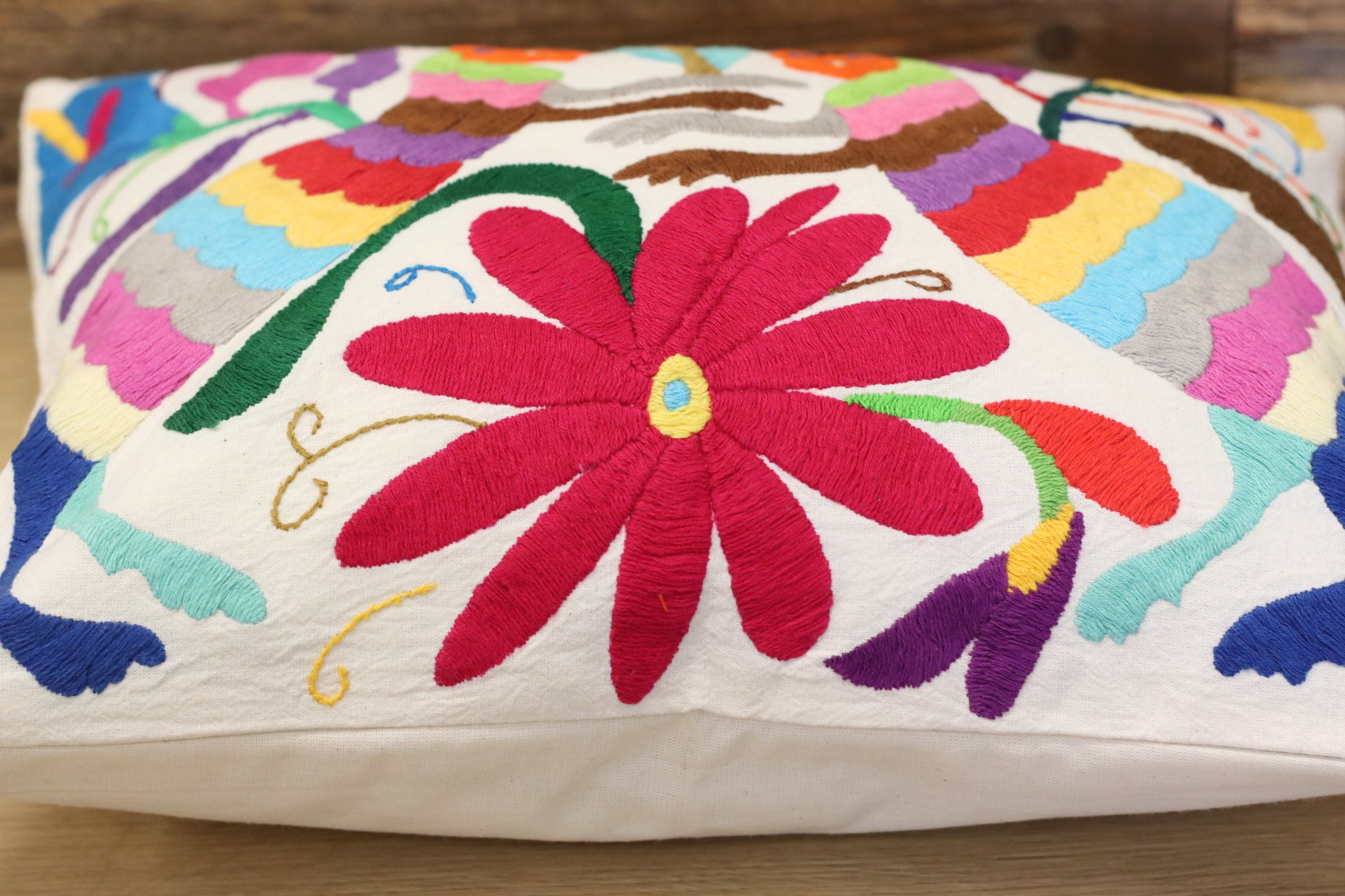 Otomi Tenango Pillow Cover Hand Embroidered with Flowers and Animals in Vibrant Colors. Handmade in Mexico. Ships from the USA. Buy now at www.felipeandgrace.com. 