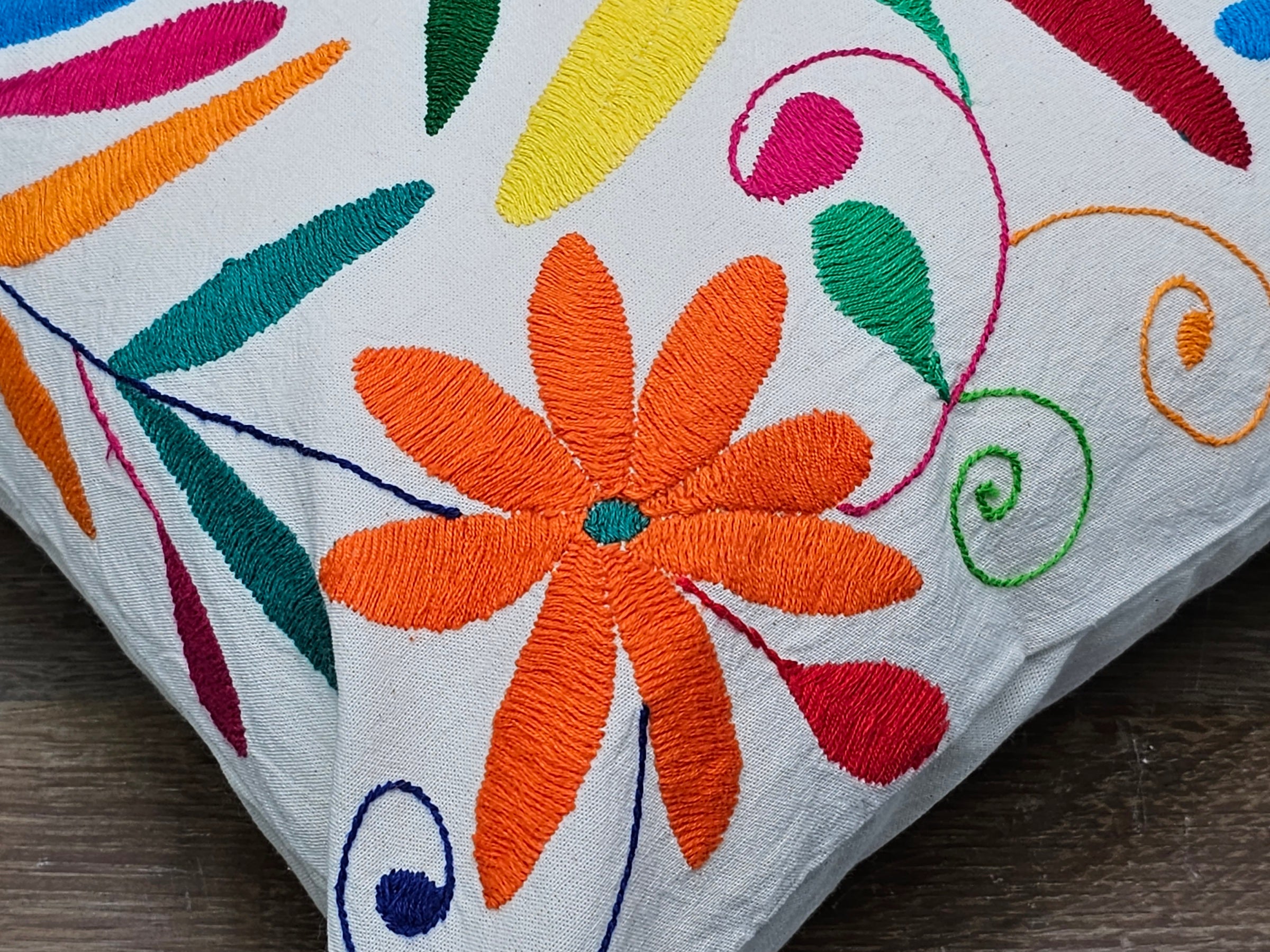 Square Otomi Tenango Pillow Cover with Hand Embroidered Dragonfly and Flower Design in Vibrant Colors. Handmade in Mexico. Ships from the USA. Buy now at www.felipeandgrace.com.