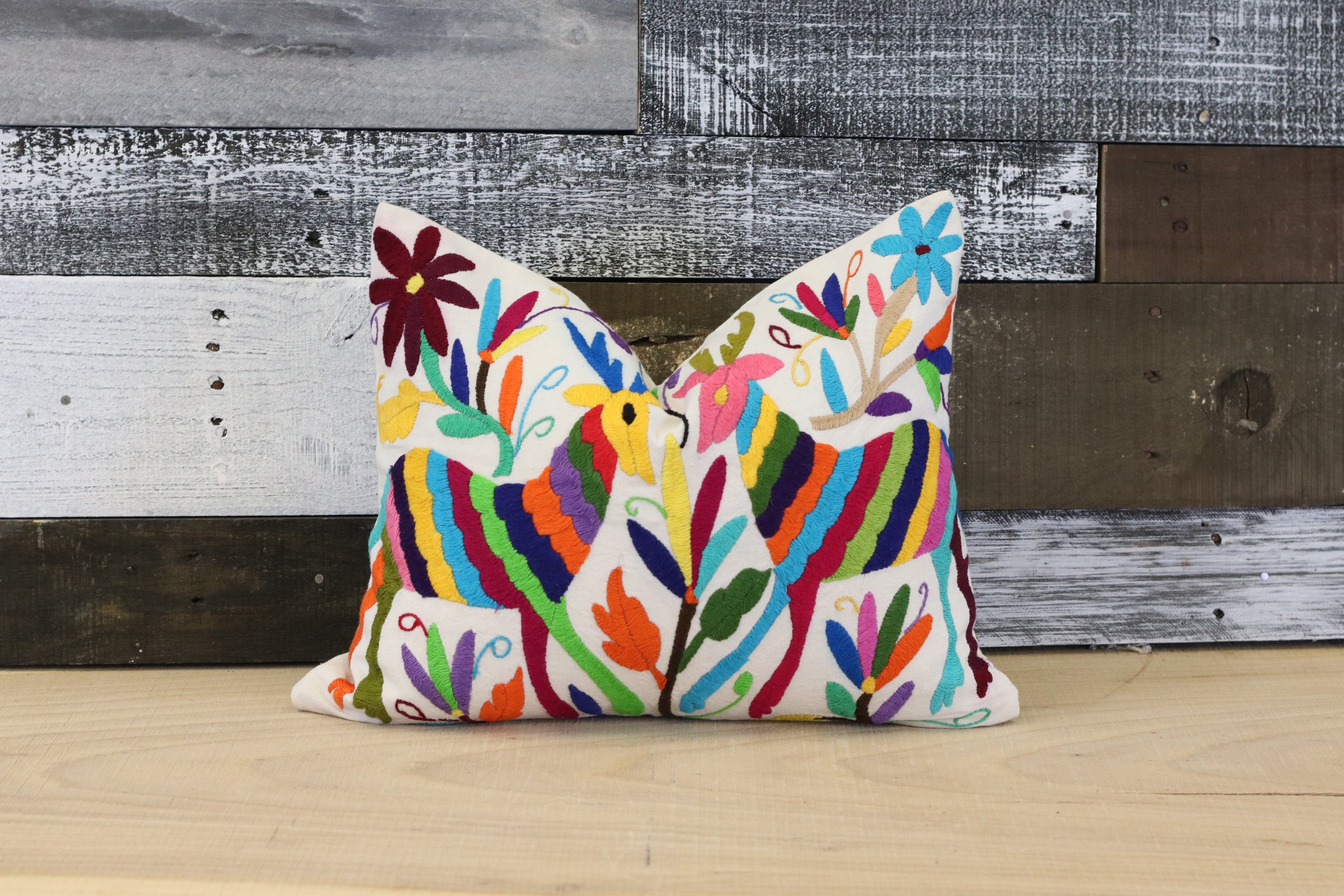 Otomi Tenango Pillow Cover Hand Embroidered with Flowers and Animals in Vibrant Colors. Handmade in Mexico. Ships from the USA. Buy now at www.felipeandgrace.com. 