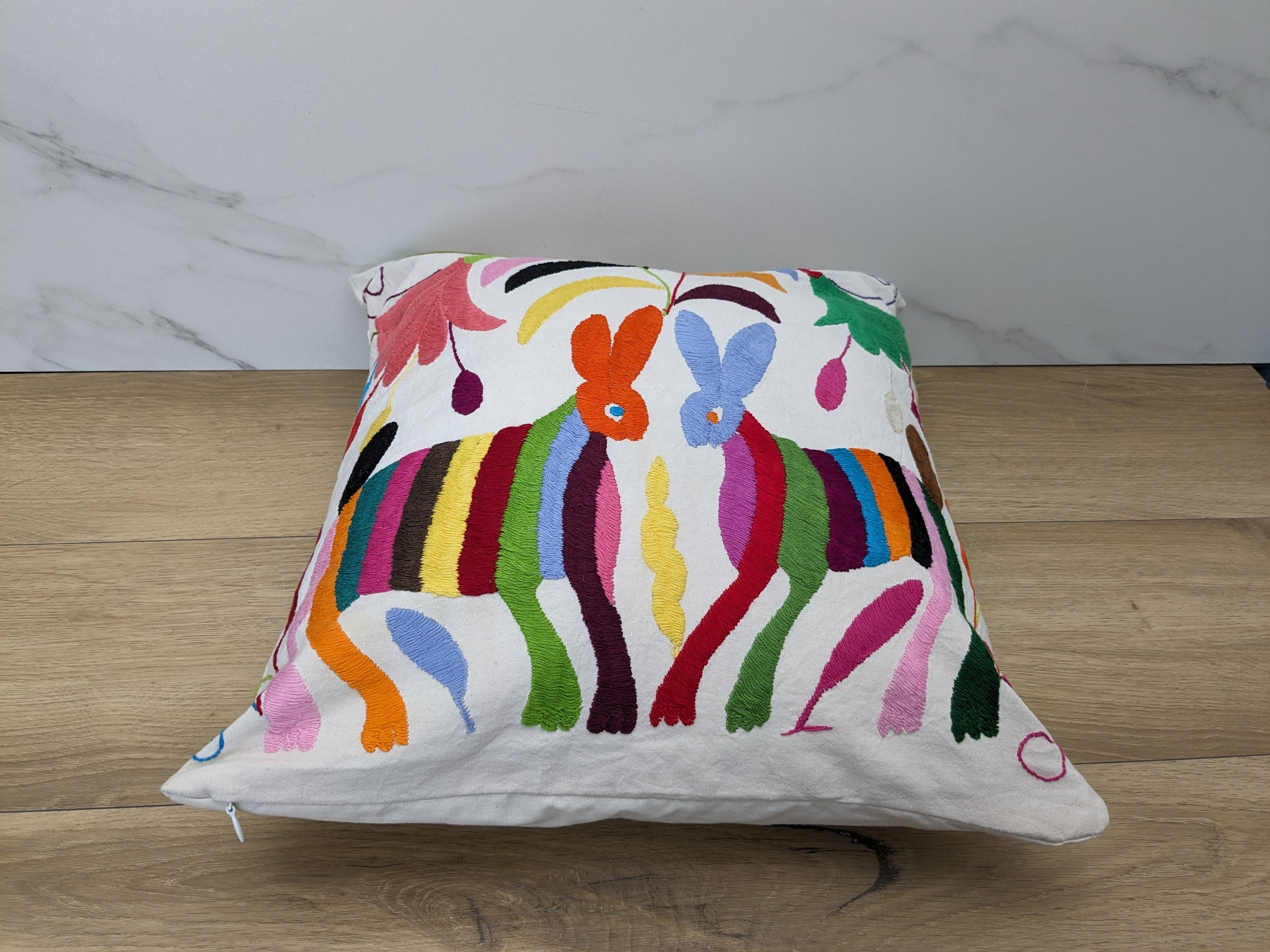 Multicolor Mexican Embroidered Throw Pillow Cover with Animals and Flowers. Handmade in Mexico. We package and ship from the USA. Buy now at www.felipeandgrace.com.
