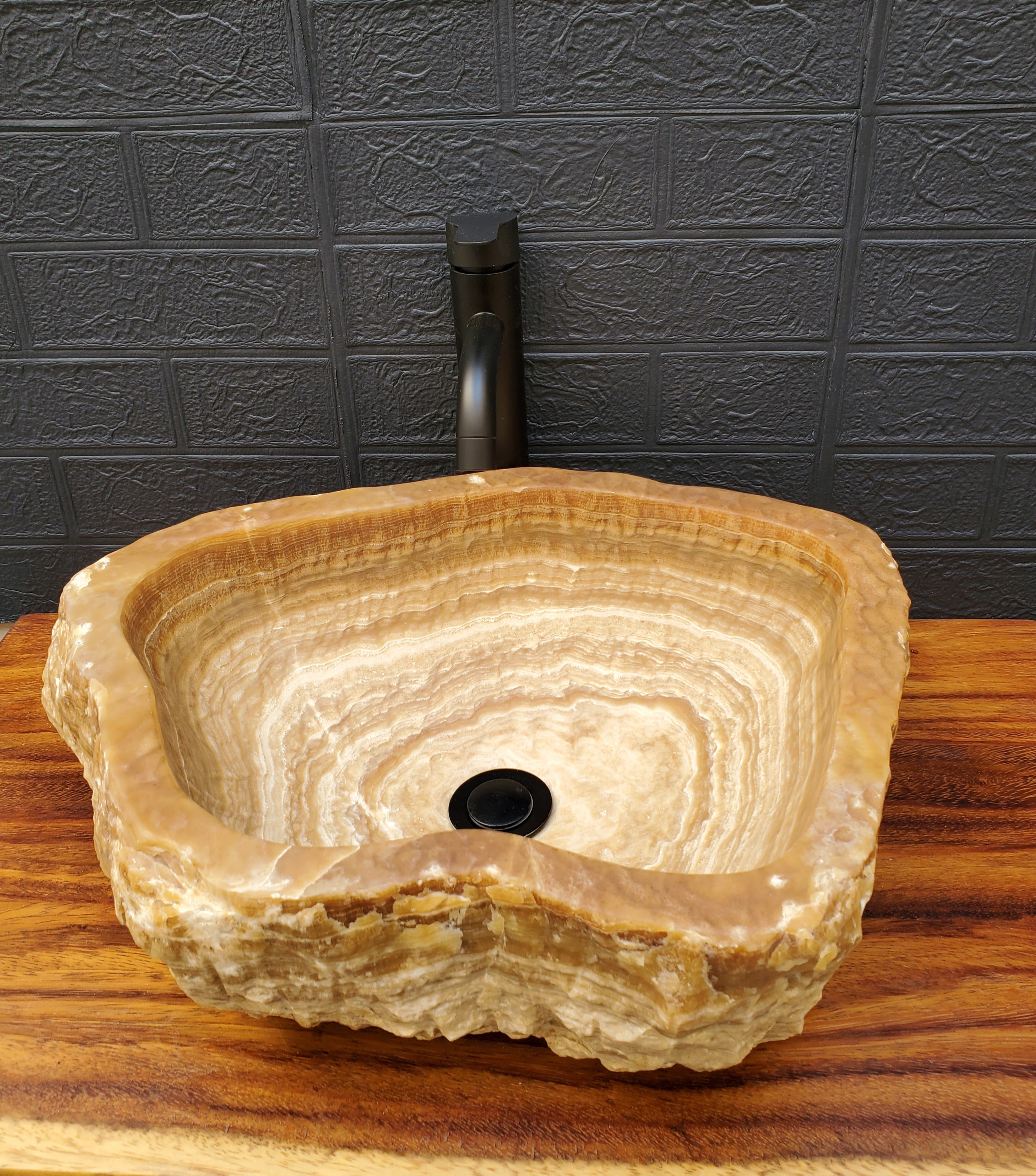 White and Brown Onyx Stone Vessel Sink. It is one of a kind. A beautiful work of art. Handmade in Mexico. Hand Finished in the USA. Ships from the USA. A beautiful work of art. Buy now at www.felipeandgrace.com. 