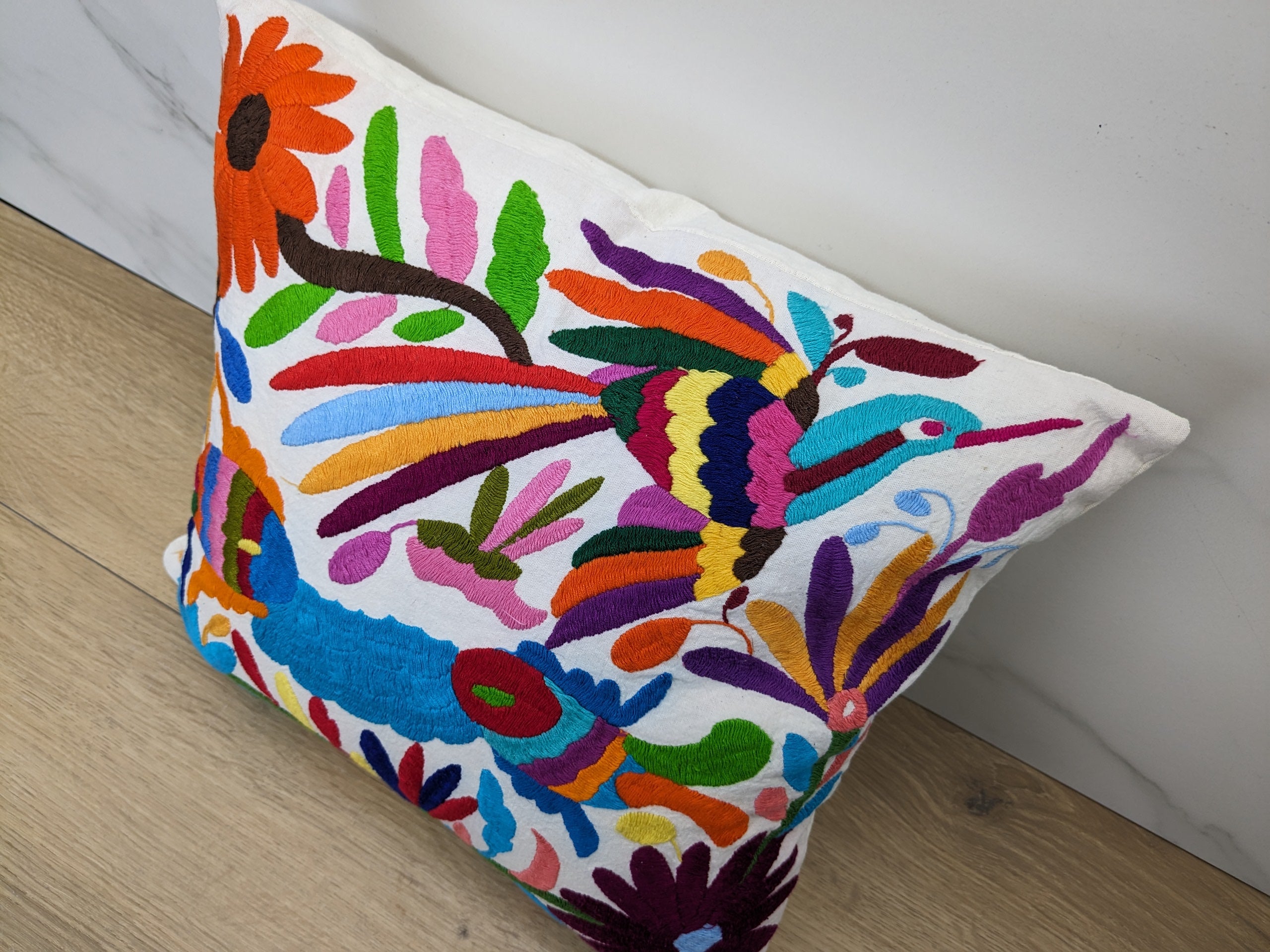 Multicolor Mexican Embroidered Throw Pillow Cover with Birds, Flowers, Animals, and Fish. Handmade in Mexico. We package and ship from the USA. Buy now at www.felipeandgrace.com.