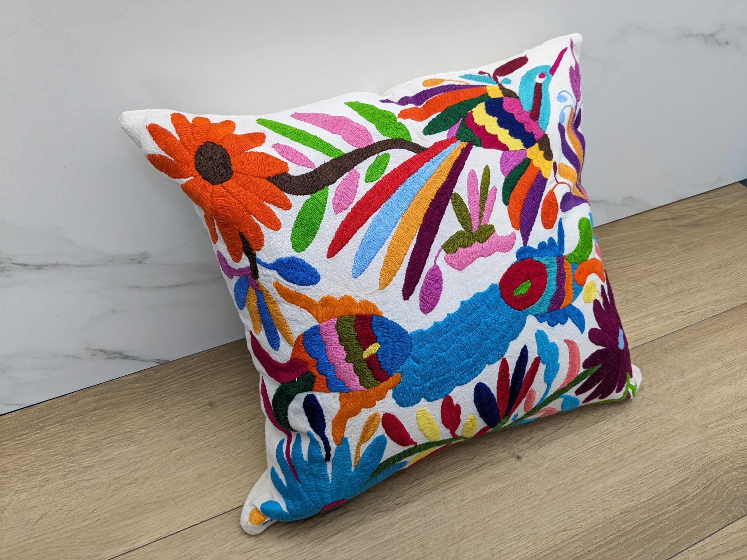 Multicolor Mexican Embroidered Throw Pillow Cover with Birds, Flowers, Animals, and Fish. Handmade in Mexico. We package and ship from the USA. Buy now at www.felipeandgrace.com.