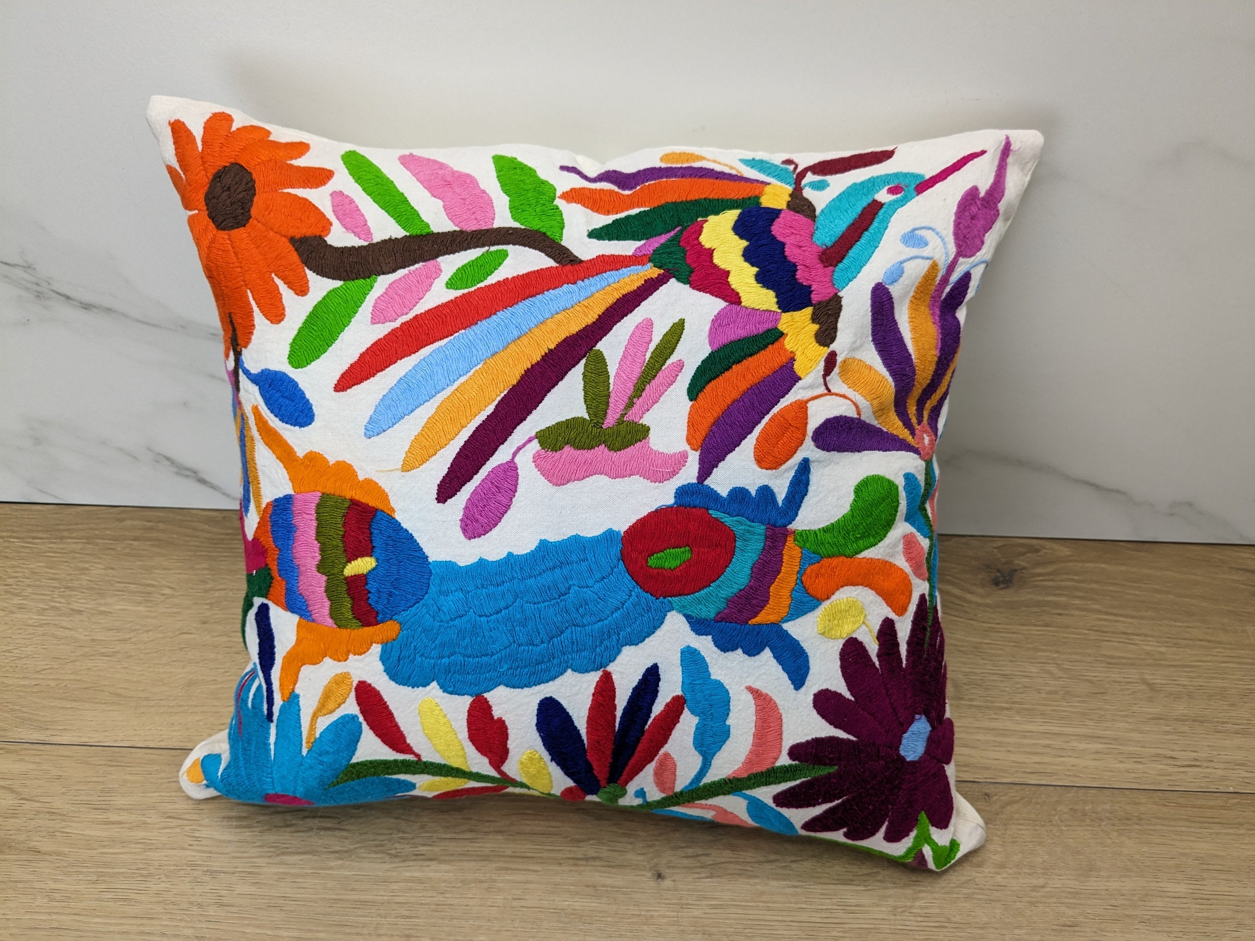 Multicolor Mexican Embroidered Throw Pillow Cover with Birds, Flowers, Animals, and Fish. Handmade in Mexico. We package and ship from the USA. Buy now at www.felipeandgrace.com.