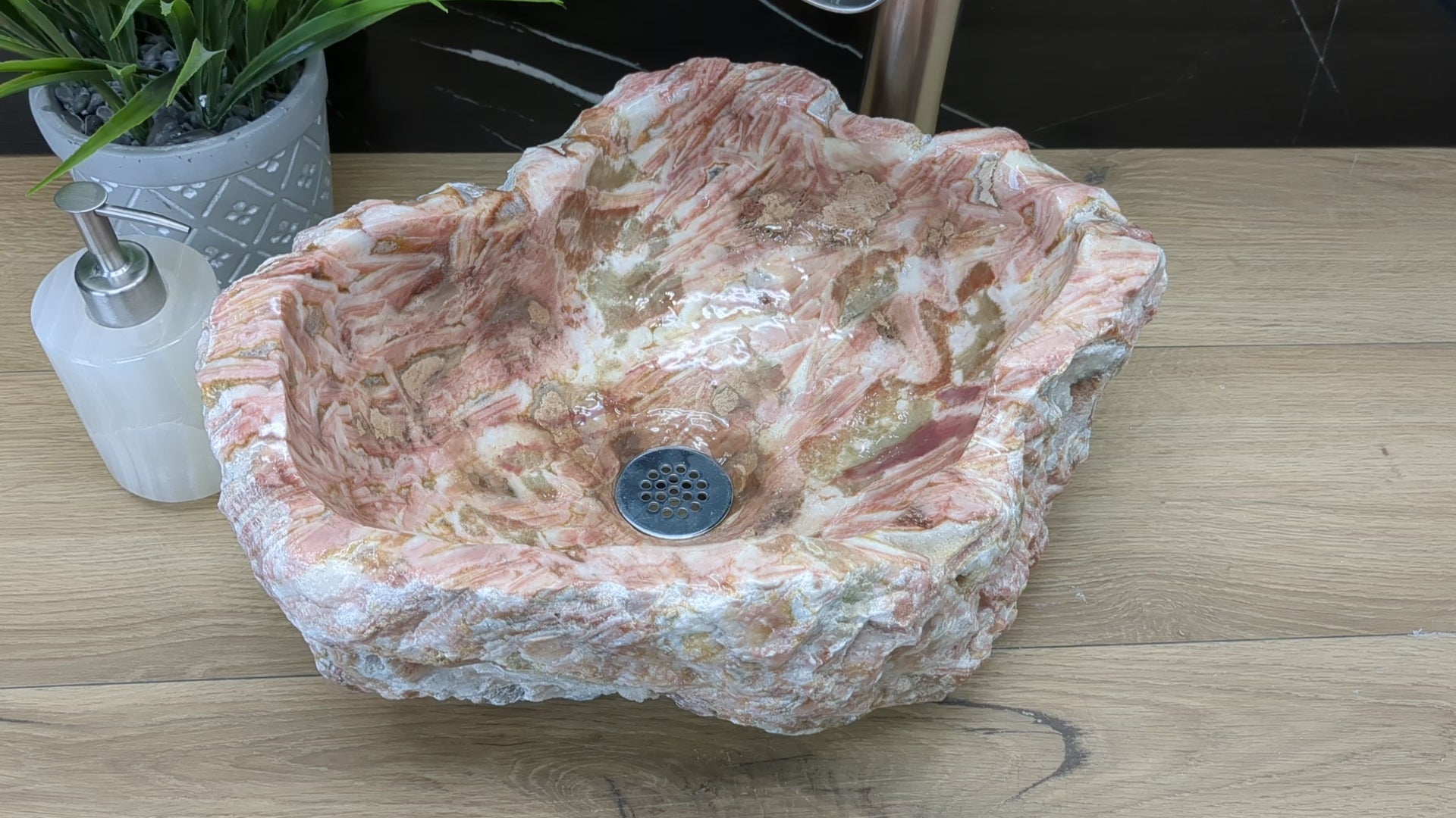 Pink Brown and White Onyx Vessel Sink. A stunning work of art. Handmade in Mexico. We hand finish, package, and ship from the USA. Buy now at www.felipeandgrace.com.