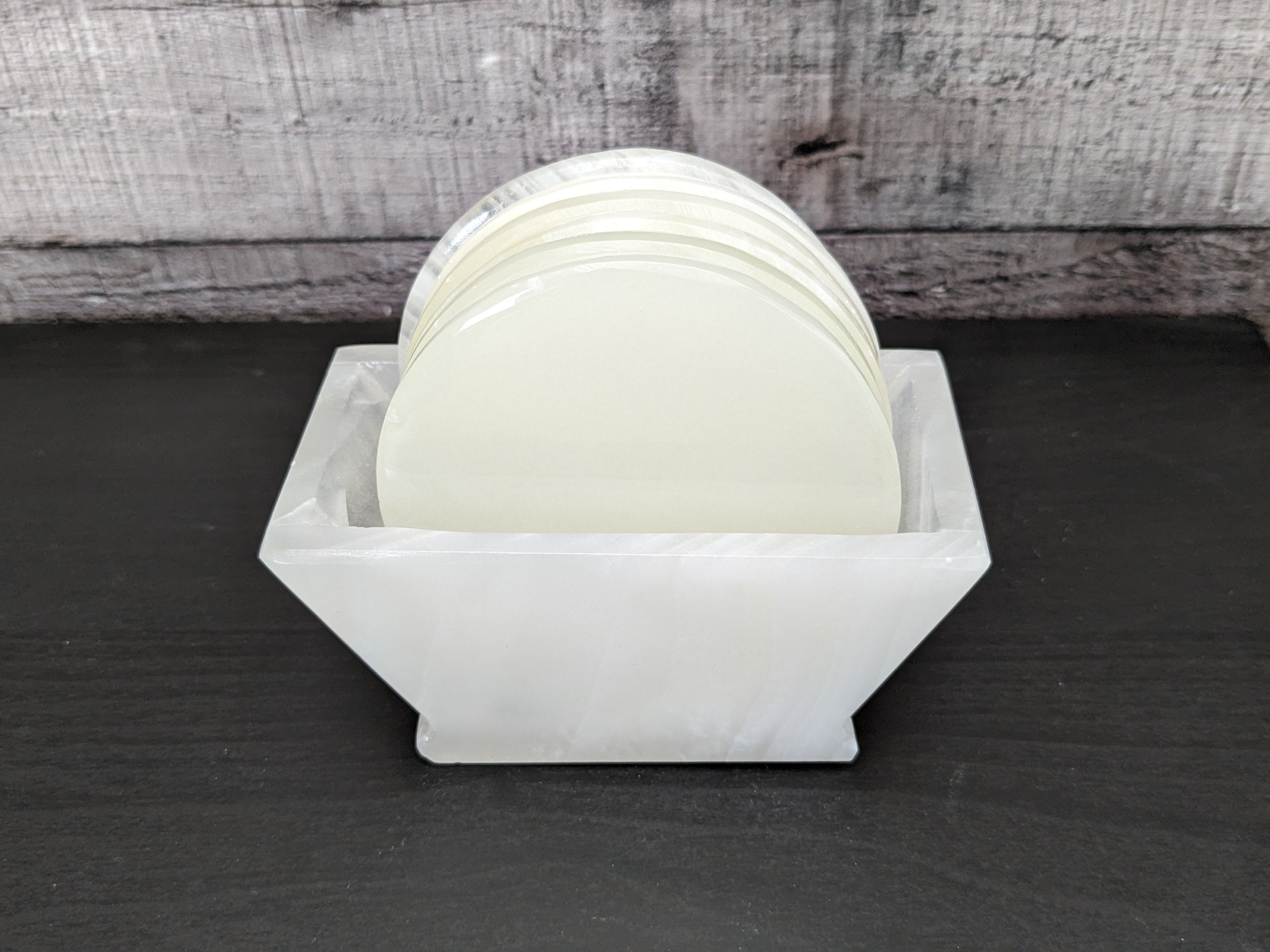 White Onyx Coaster Set of Six with Holder. The coasters are round. Handmade in Mexico. Ships from the USA. Buy now at www.felipeandgrace.com.