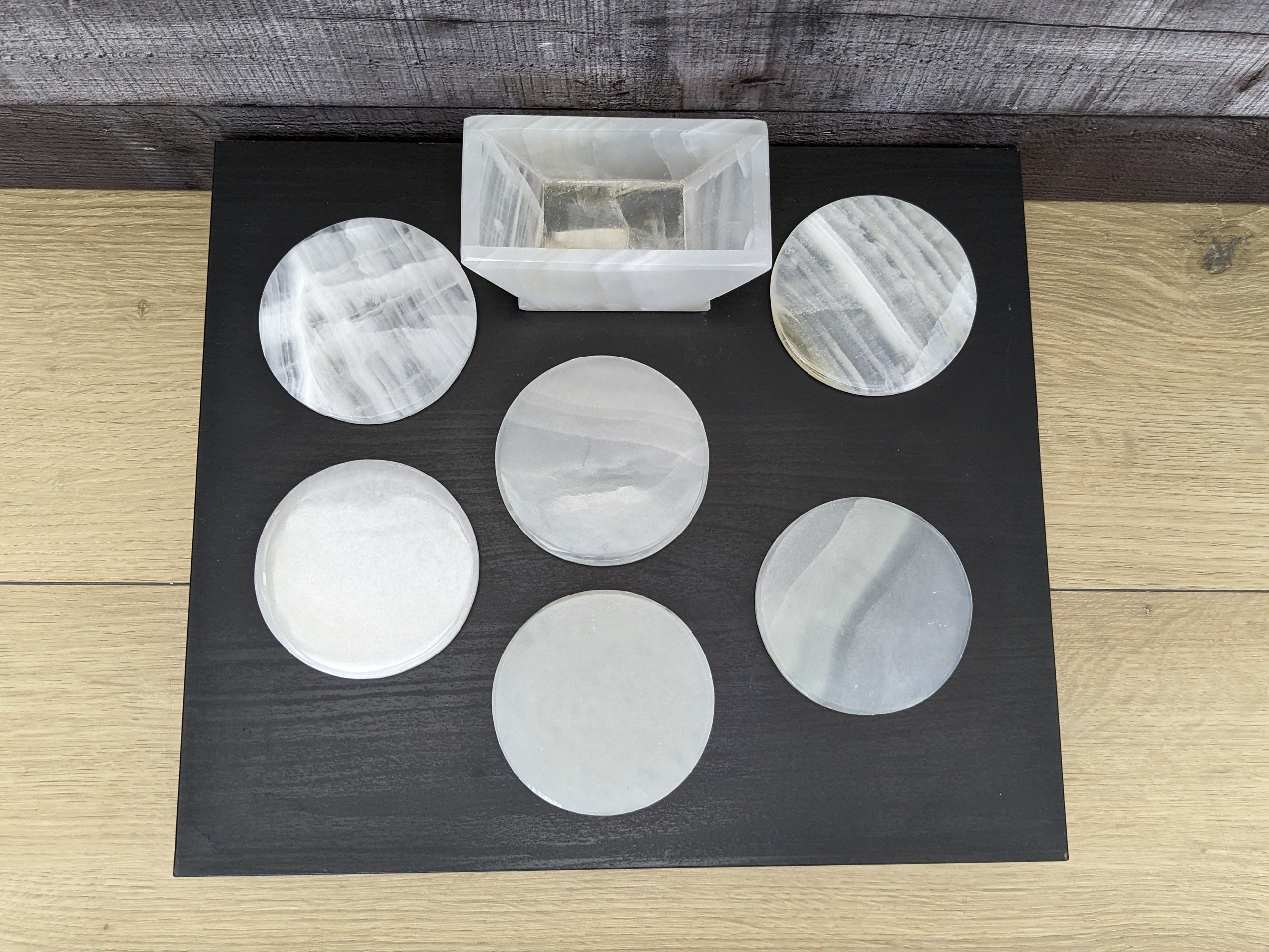 White Onyx Coaster Set of Six with Holder. The coasters are round. Handmade in Mexico. Ships from the USA. Buy now at www.felipeandgrace.com.