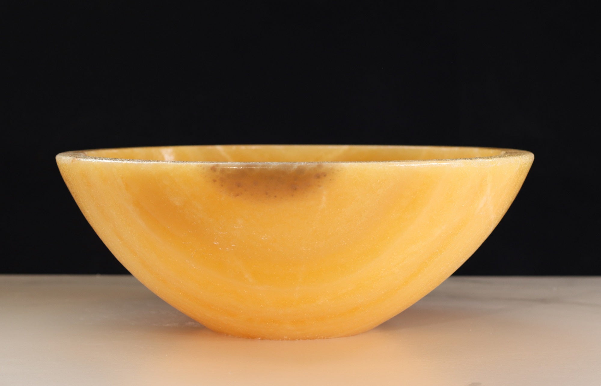 Beige and Orange Round Onyx Stone Bathroom Vessel Sink. A beautiful work of art. We offer fast shipping. Handmade in Mexico. We hand finish, package, and ship from the USA. Buy now at www.felipeandgrace.com. 