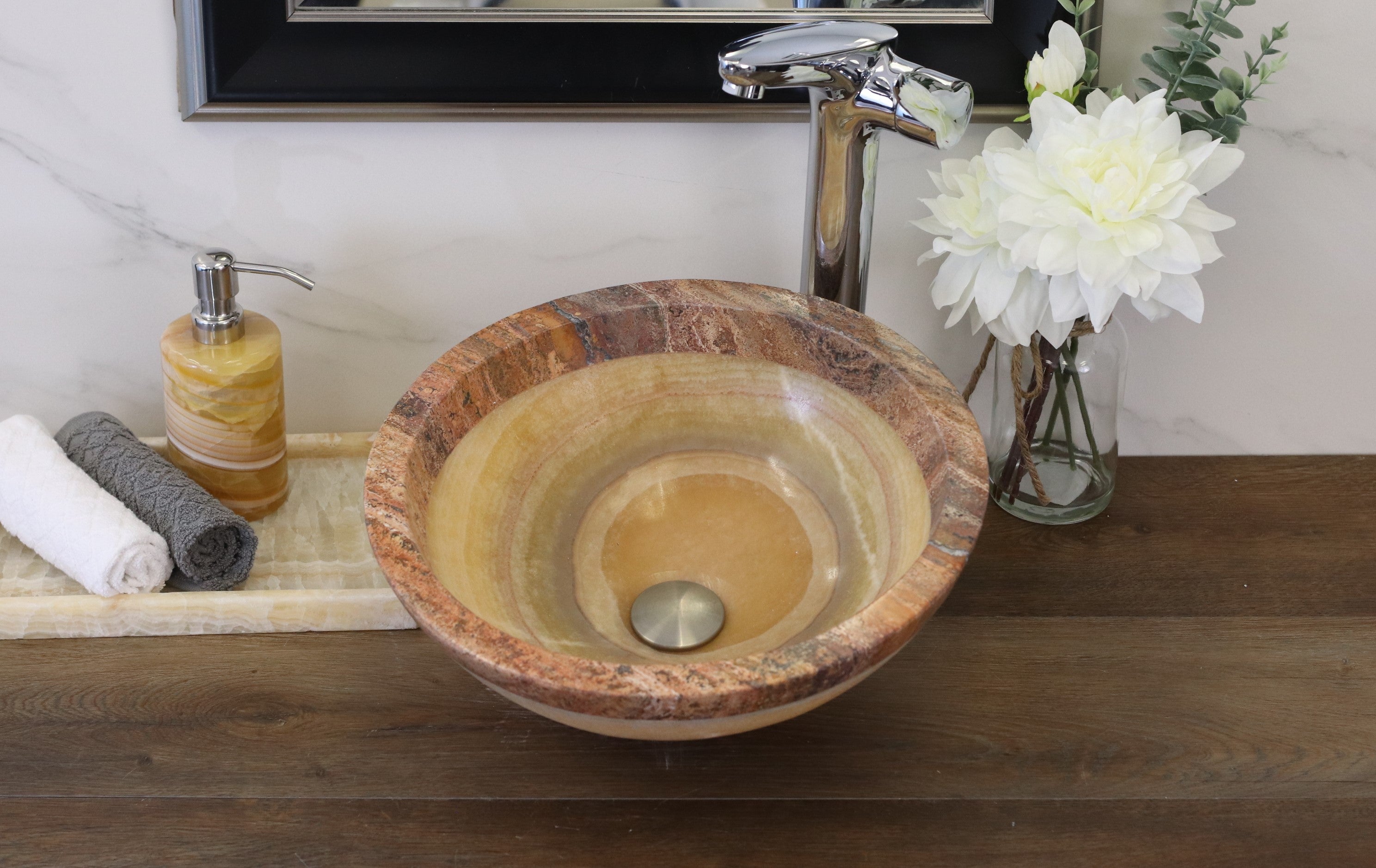 Beige and Brown Onyx and Travertine Round Vessel Sink. A beautiful work of art. We offer fast shipping. Handmade in Mexico. We hand finish, package, and ship from the USA. Buy now at www.felipeandgrace.com. 