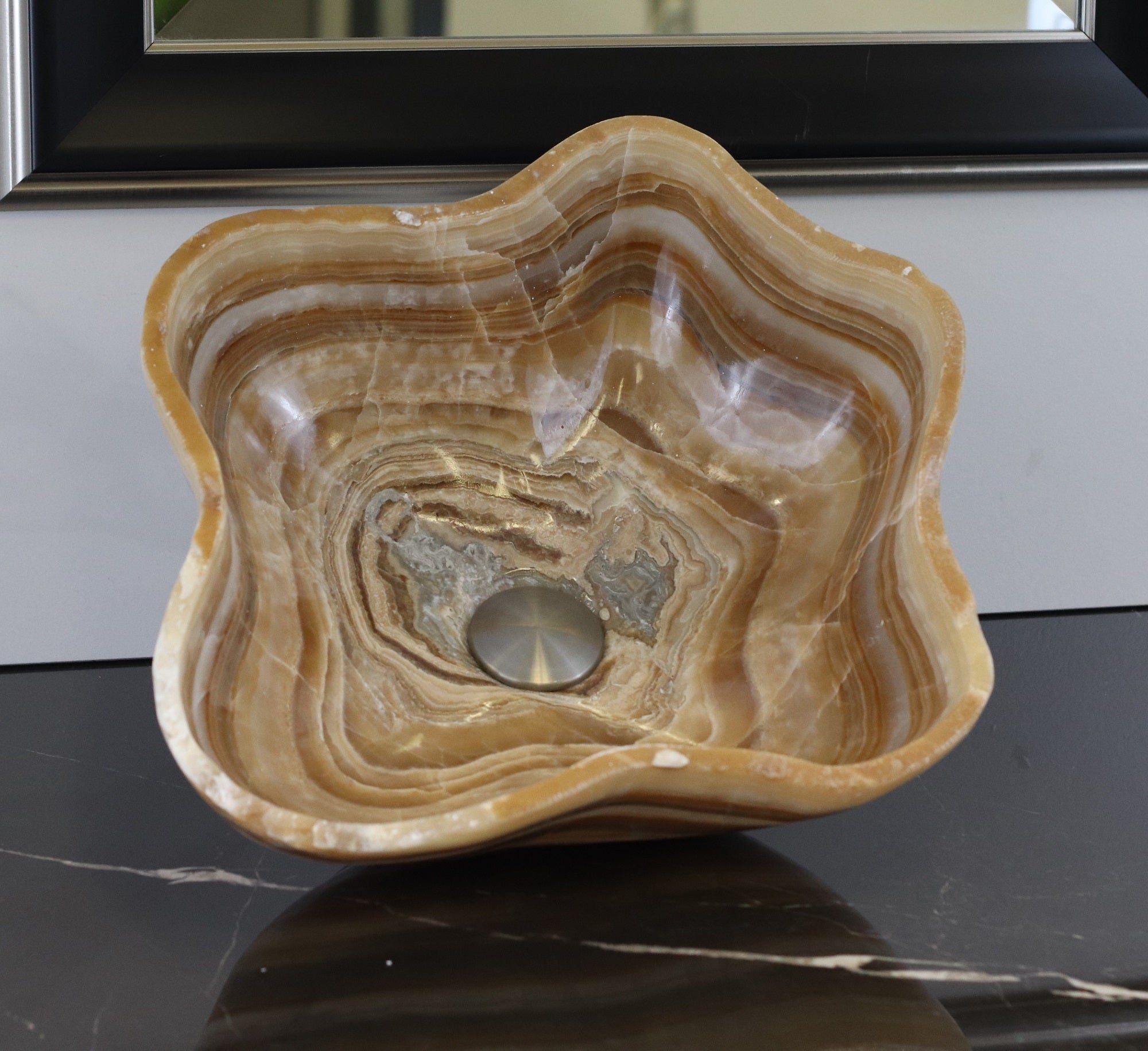 Brown and Tan Wavy Polished Vessel Sink. A beautiful work of art. We offer fast shipping. Handmade in Mexico. We hand finish, package, and ship from the USA. Buy now at www.felipeandgrace.com. 