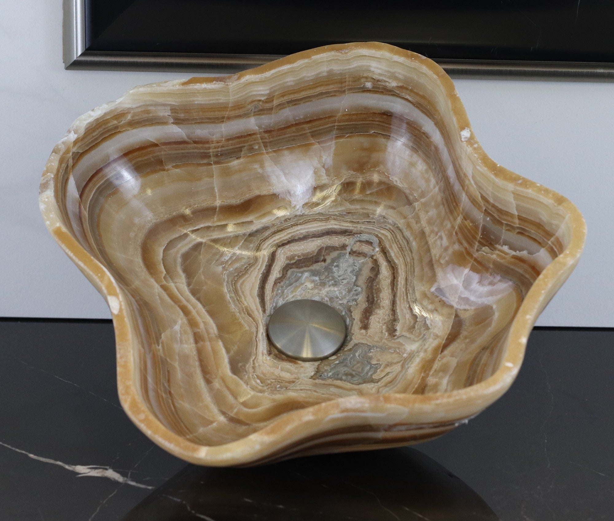 Brown and Tan Wavy Polished Vessel Sink. A beautiful work of art. We offer fast shipping. Handmade in Mexico. We hand finish, package, and ship from the USA. Buy now at www.felipeandgrace.com. 