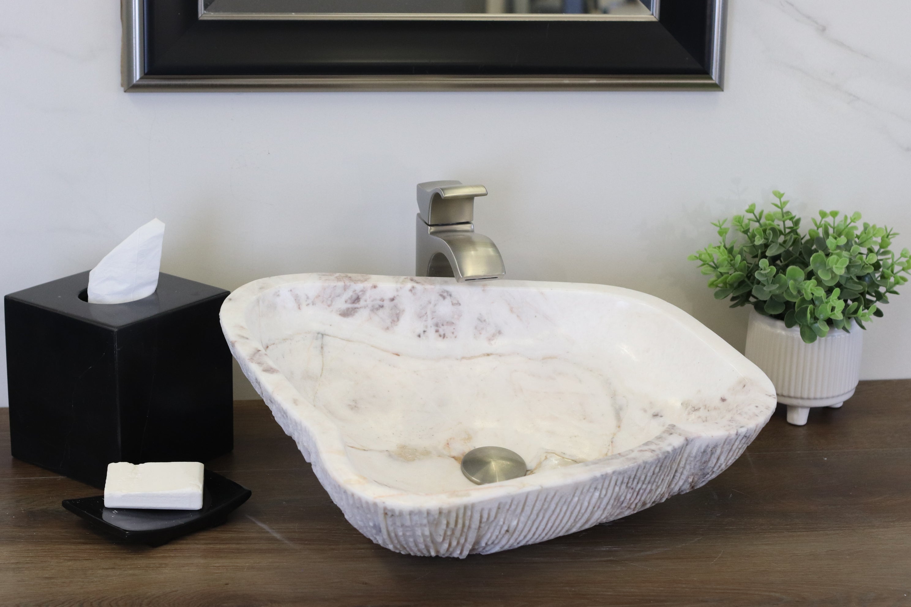 White Onyx Vessel Sink. A beautiful work of art. We offer fast shipping. Handmade in Mexico. We hand finish, package, and ship from the USA. Buy now at www.felipeandgrace.com. 